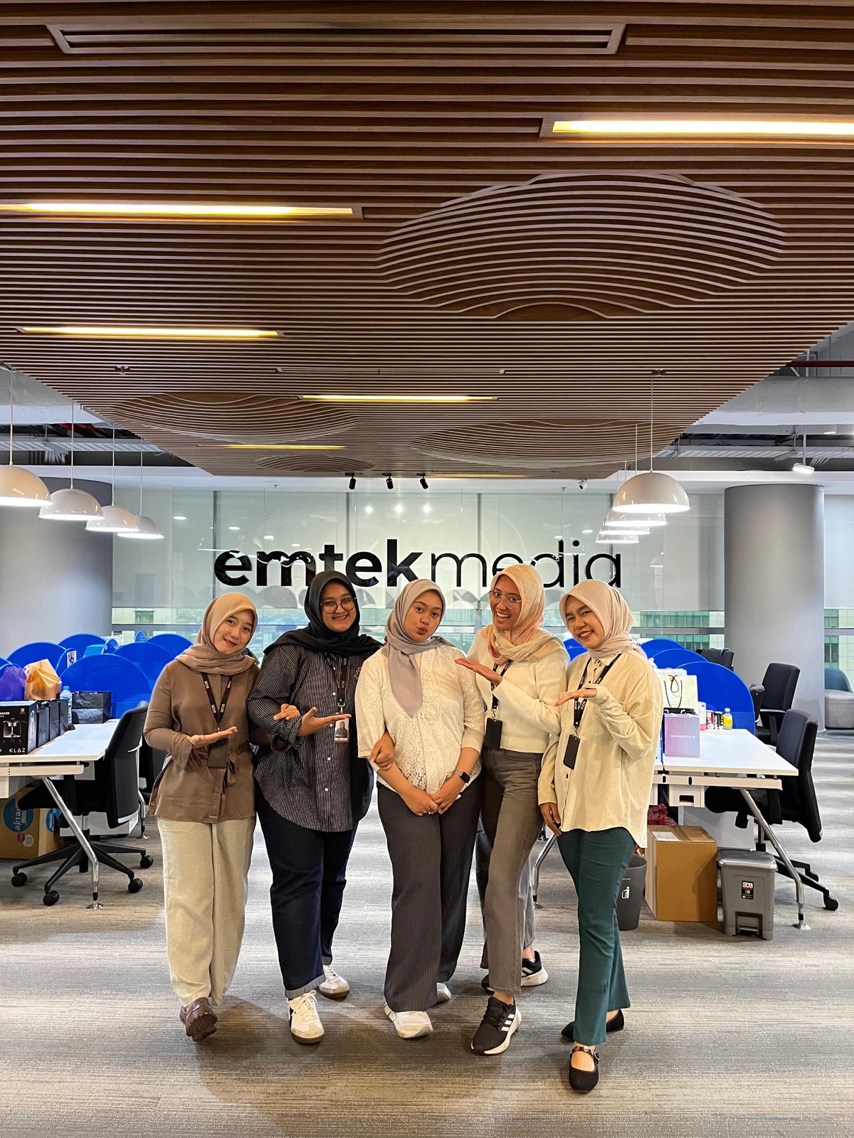 Lidya Aprillia with the team at Emtek Media office